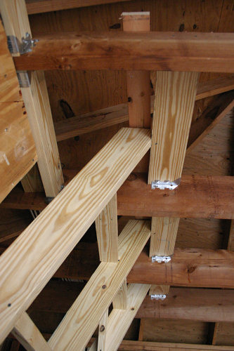 Climbing wall stringer framing at the rafters