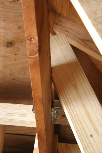 Climbing wall stringer framing at the rafters
