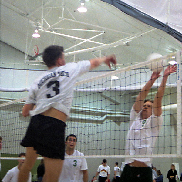 Steve Anderson spikes over a block