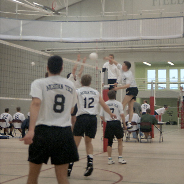 Steve Anderson hitting over a block